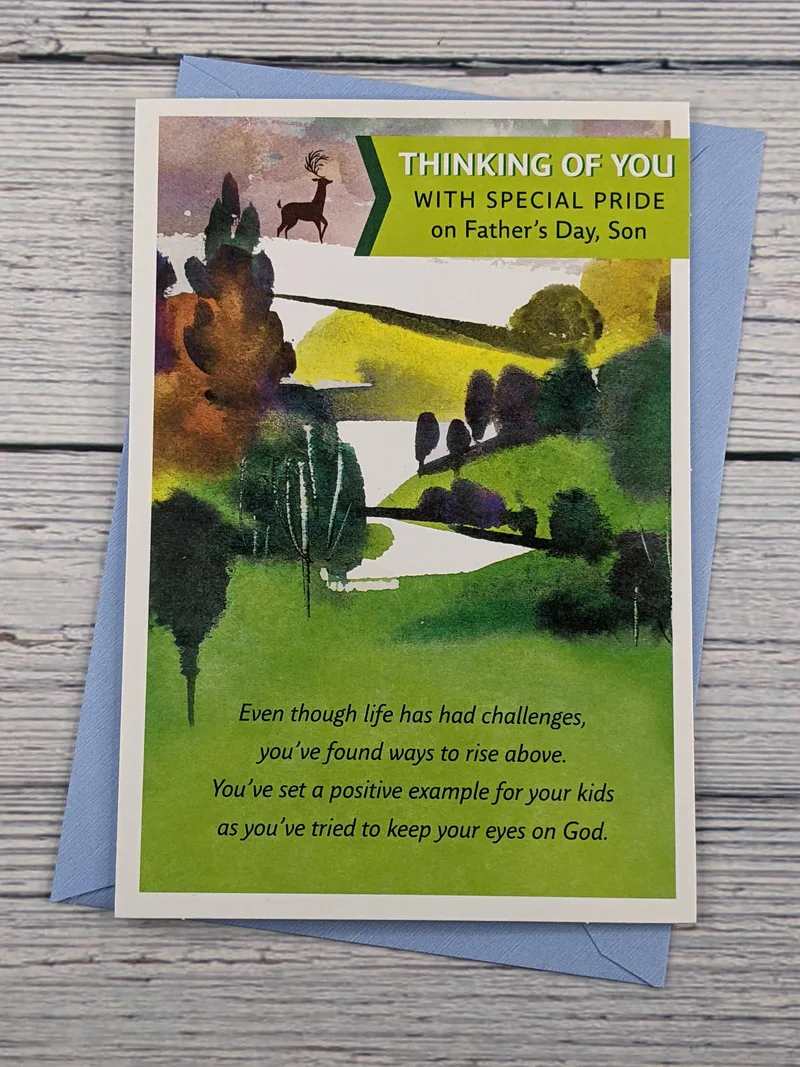 A Dayspring Father's Day greeting card for a son, featuring an image of trees, grass, and a deer.
