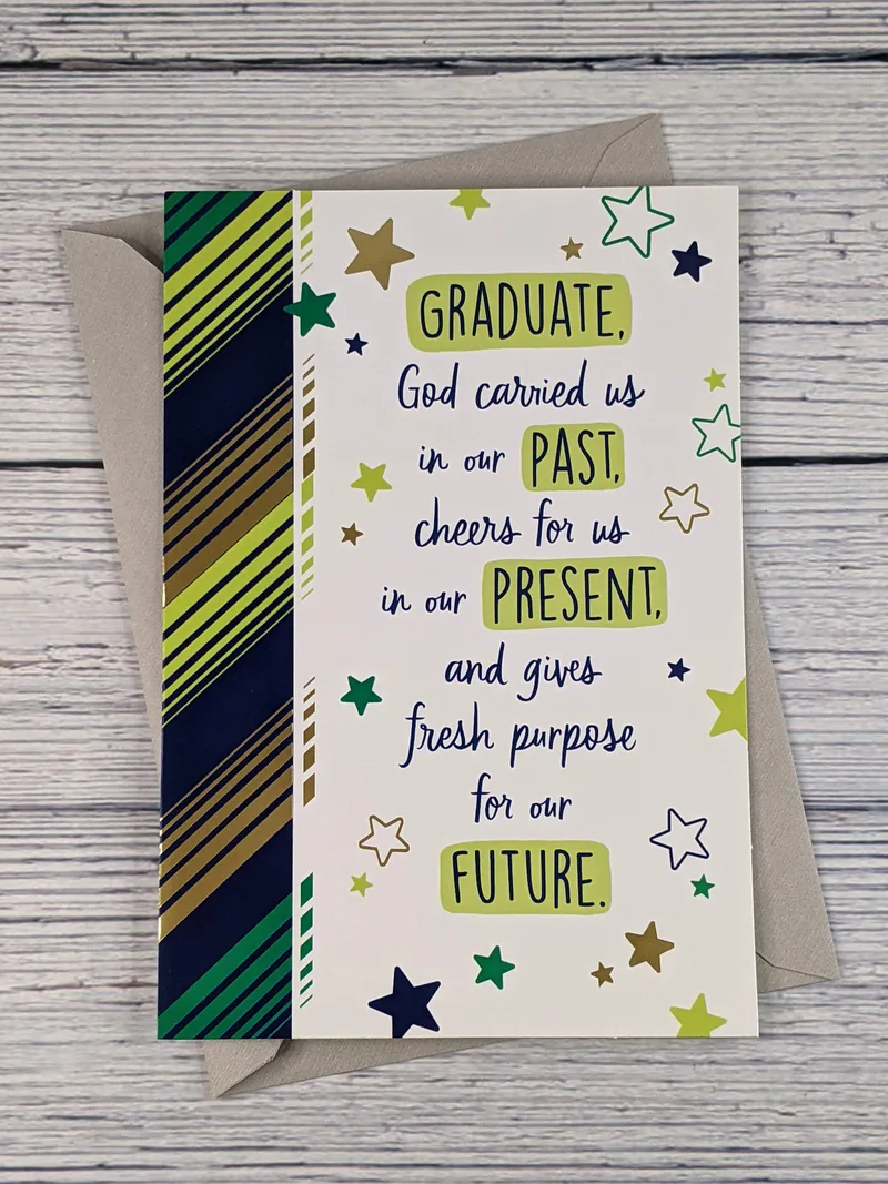 A religious graduation card with a pattern of stars and green, blue, and gold stripes.
