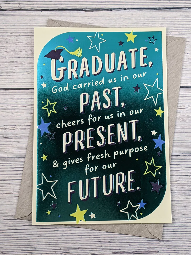 A graduation card with a metallic teal cover, with images of a grad cap, stars, and uplifting words.