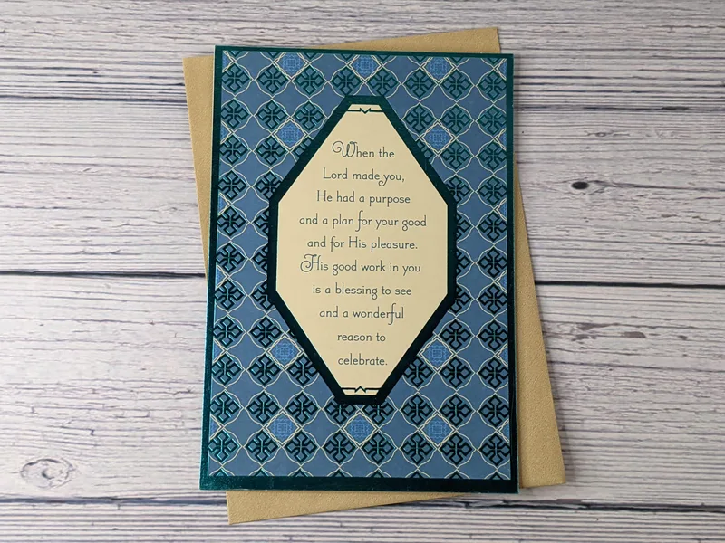 A Christian birthday card with a blue metallic cover and a religious sentiment.