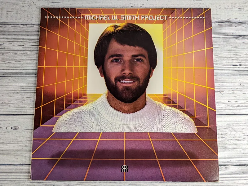 A vintage Christian Music Record Album, Michael W. Smith Project, with an image of him on the case from 1983.