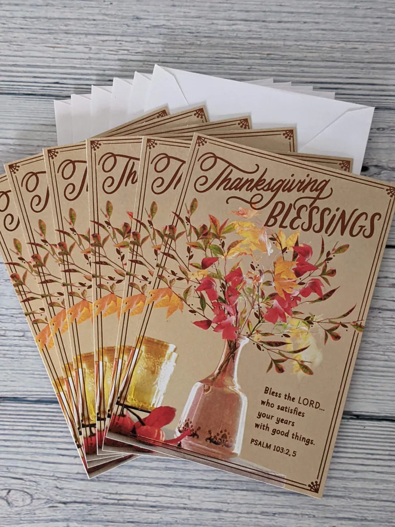 A pack of 6 religious Thanksgiving cards with an image of a pot of fall leaves.