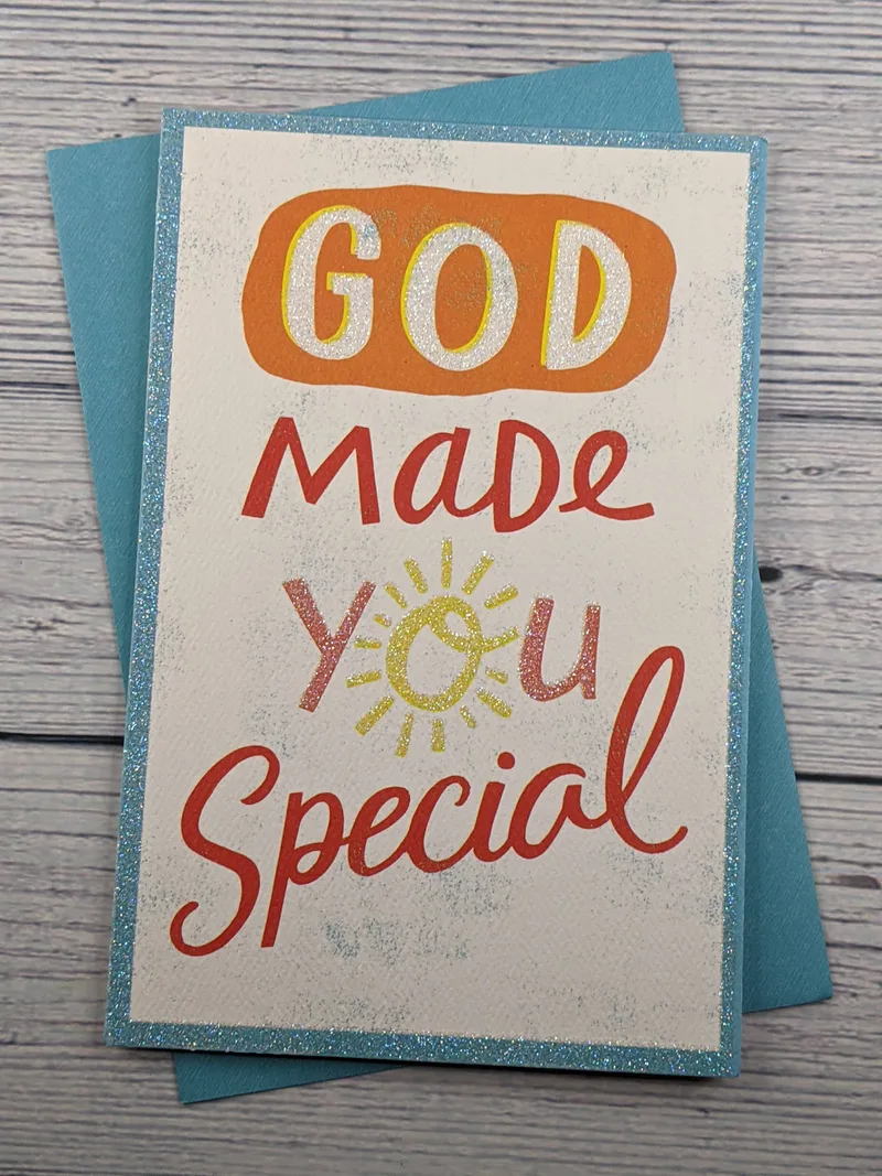 A glittery birthday card with the words "God made you special" with a blue envelope.