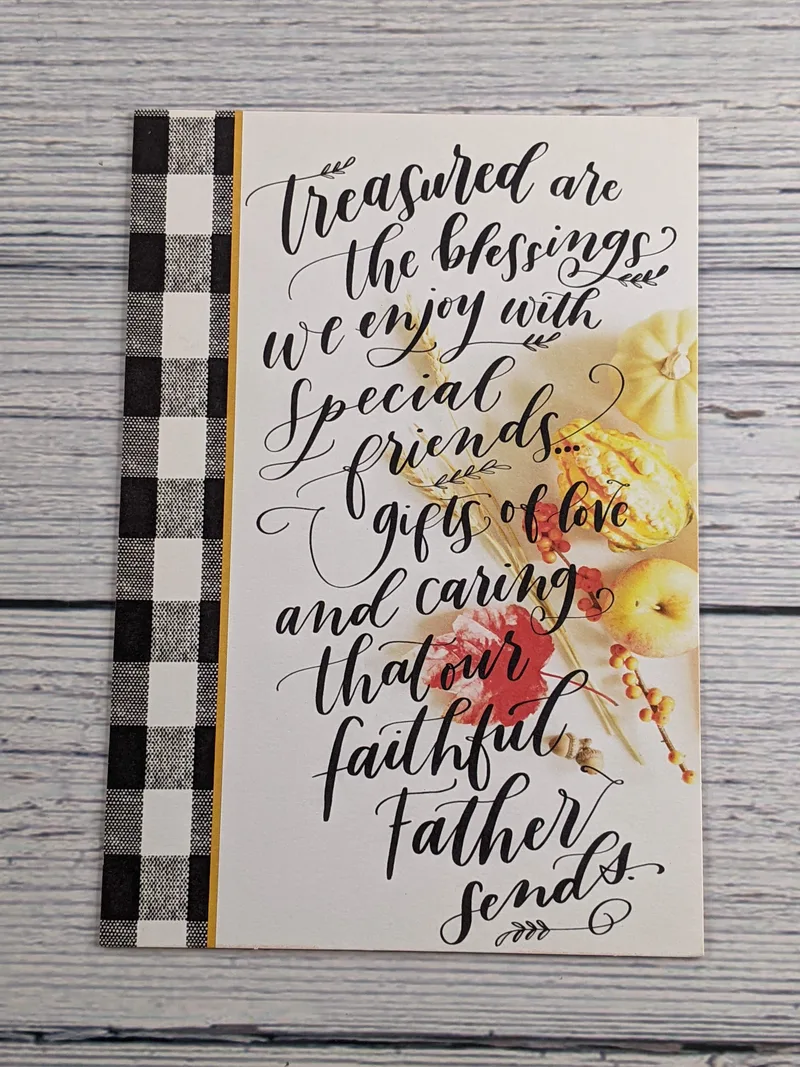A Thanksgiving card with a religious sentiment and a black and white gingham design.