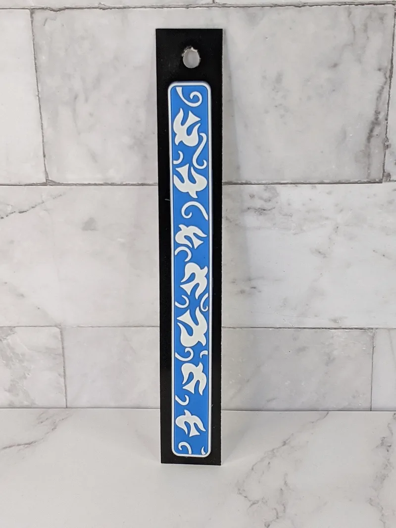 A flexible blue bookmark with a design of white doves.