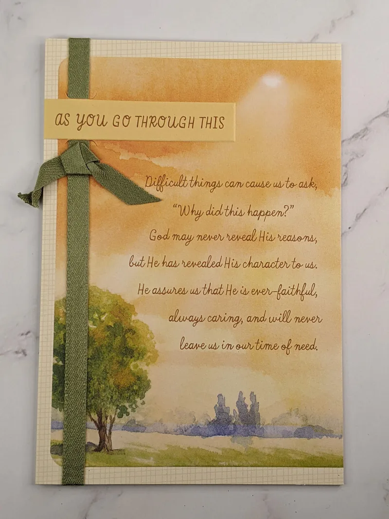 A religious greeting card to encourage someone going through a difficult time, featuring an artistic image of scenery with a tree.