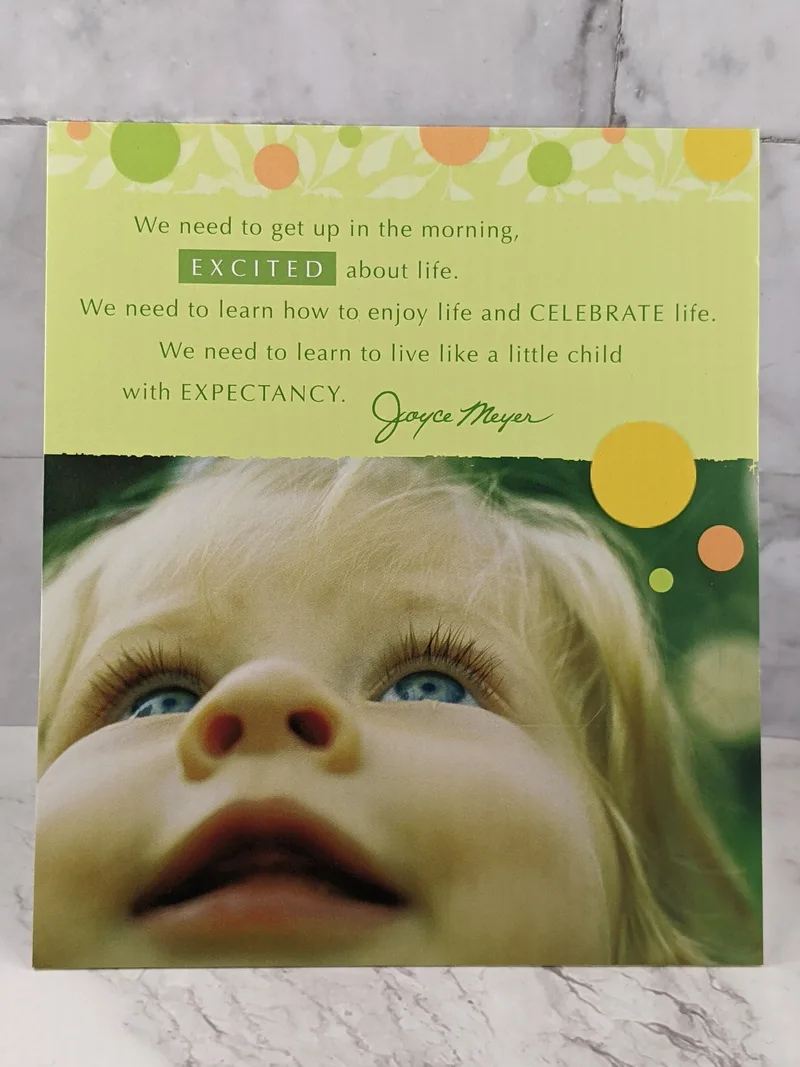A birthday card for a woman with an image of a child on the cover, and a Christian sentiment by Joyce Meyer.