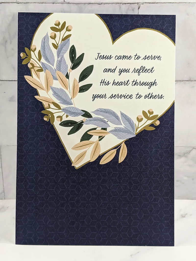 A blue greeting card with an image of a heart with leaves and a religious sentiment about church ministry.