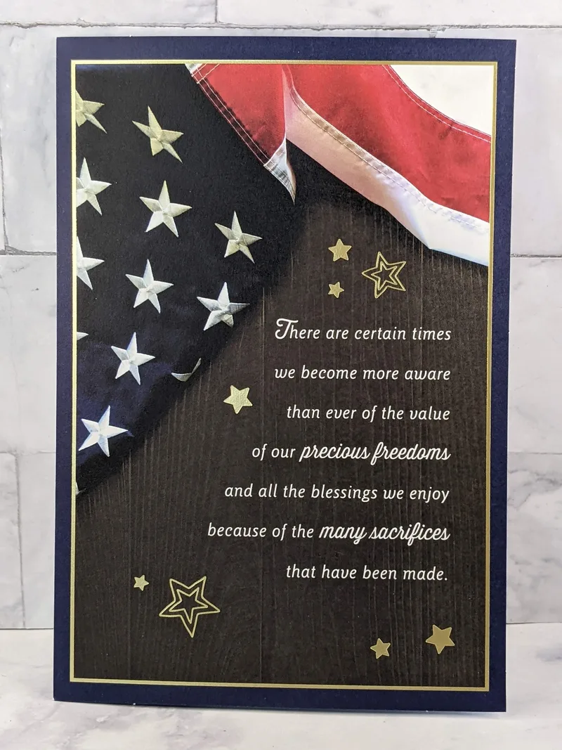 A Veteran's Day greeting card with an image of an American flag.