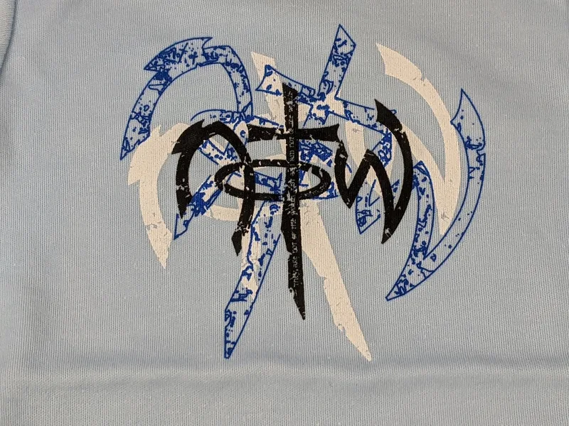A one-piece baby outfit shirt that is light blue with a NOTW logo.
